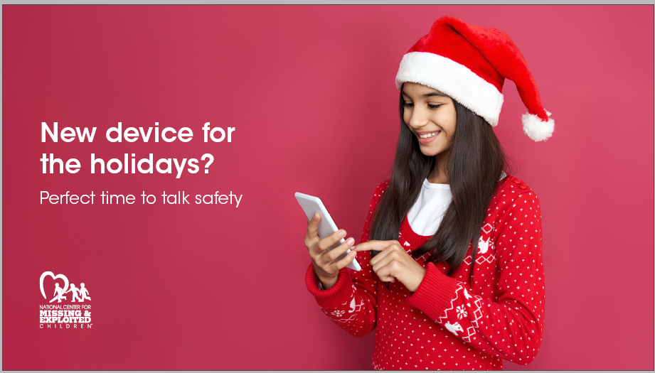 teen girl in red sweater and santa hat, holds phone